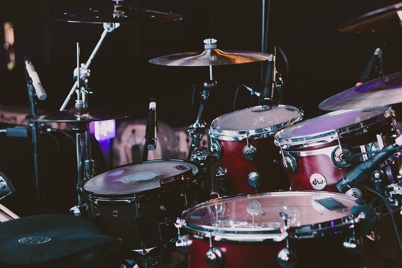 Hand playing a drum